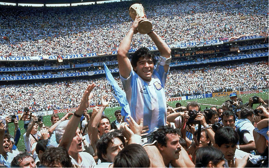 Maradona with The World Cup Trophy at 1986.