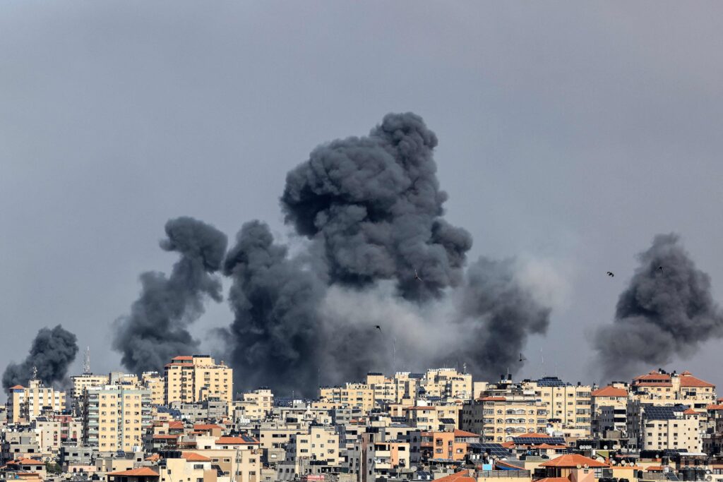 Smoke rises over Gaza City on October 7, 2023 during Israeli air strike | The Independent